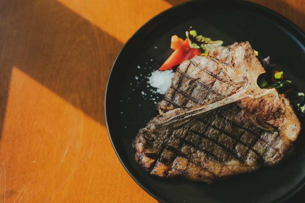 grilled meat on black plate