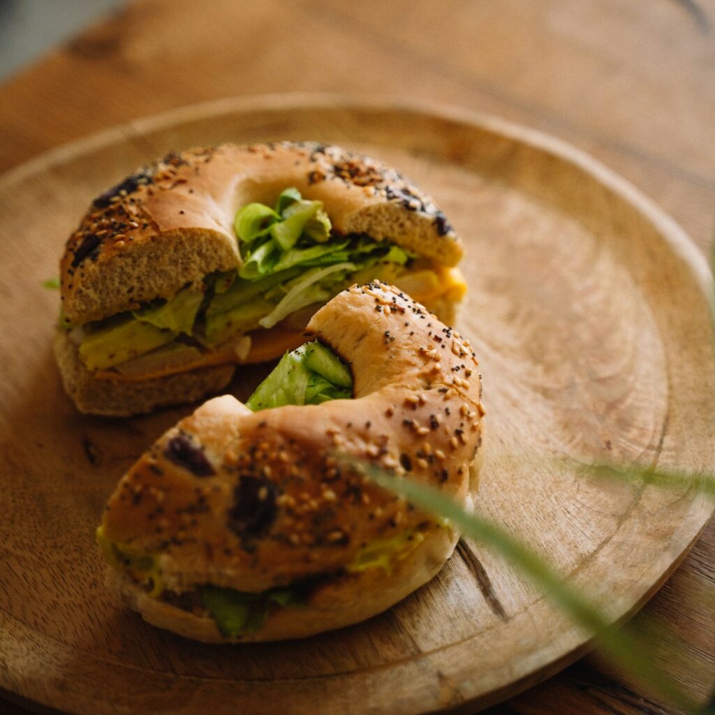 A plate with a bagel sandwich on it