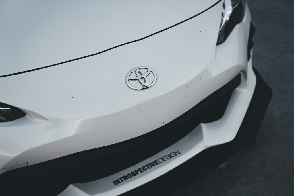 the front end of a white sports car