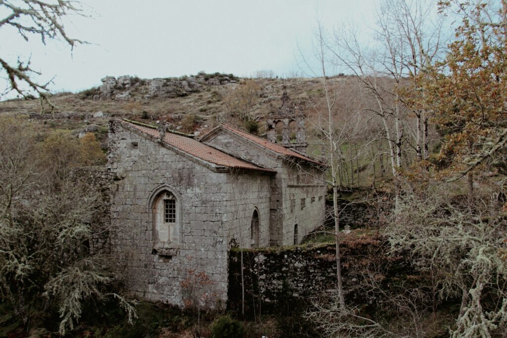 An old building sitting on top of a hill