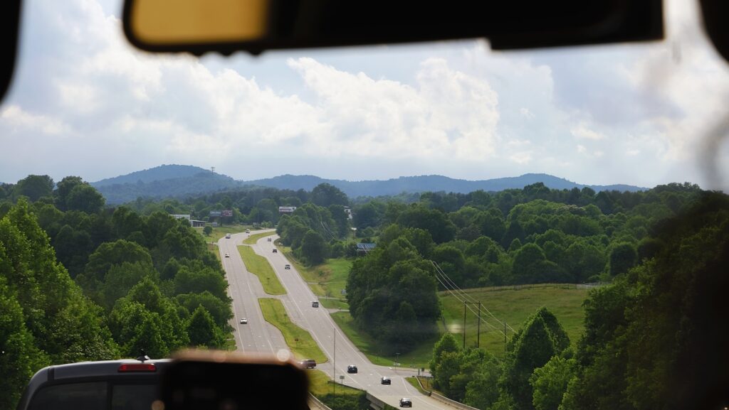 a view of a road from inside a vehicle