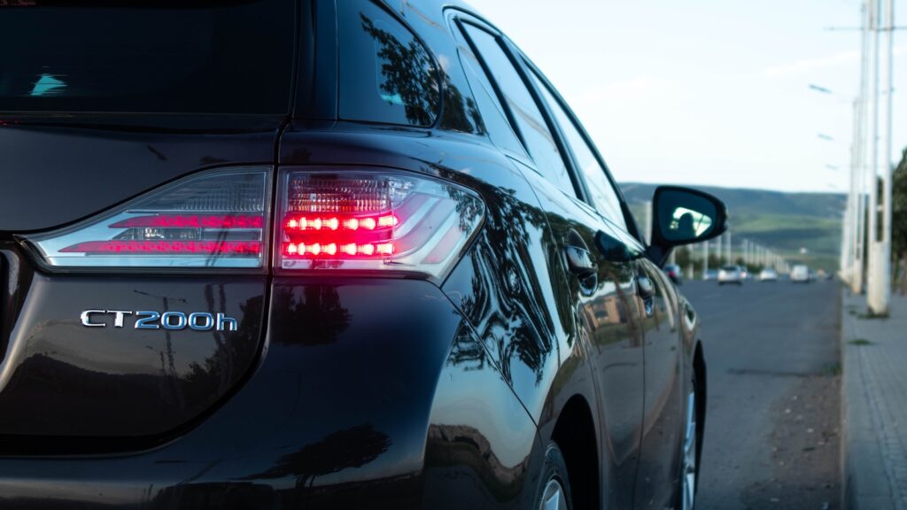 a close up of a car parked on the side of the road