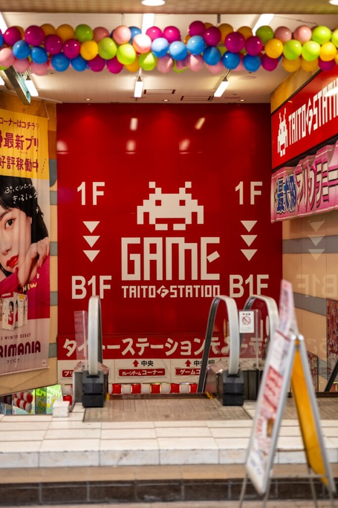 A video game store with a giant poster on the wall