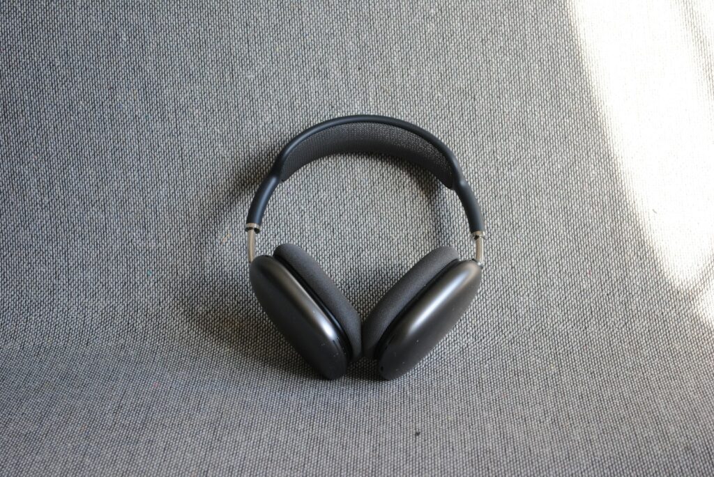 Headphones are resting on a gray surface.
