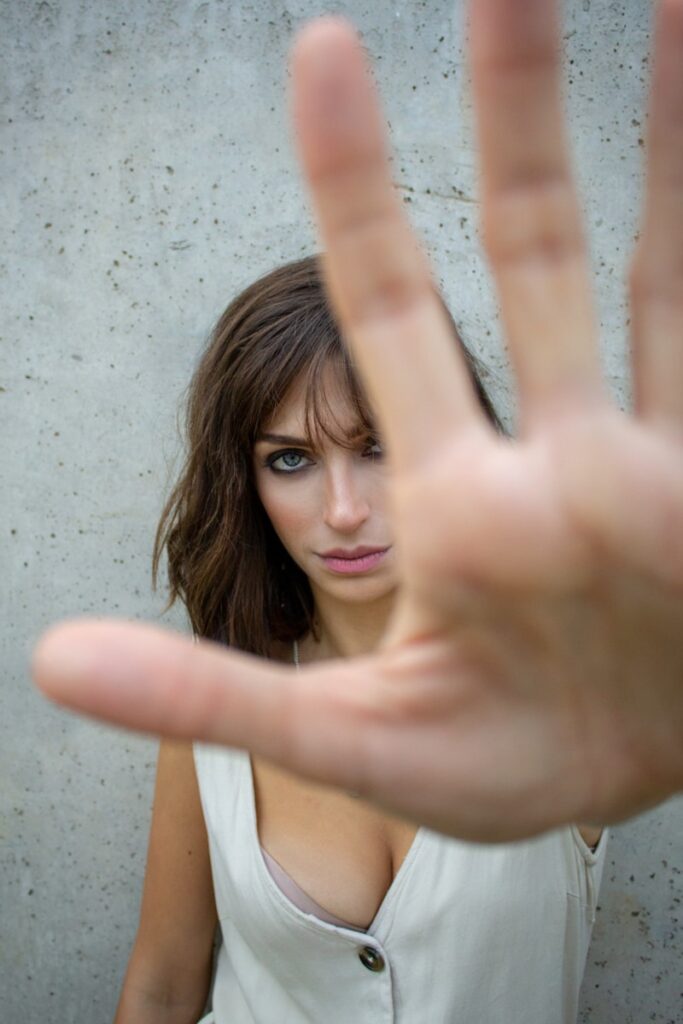 glaring woman reaching her hand