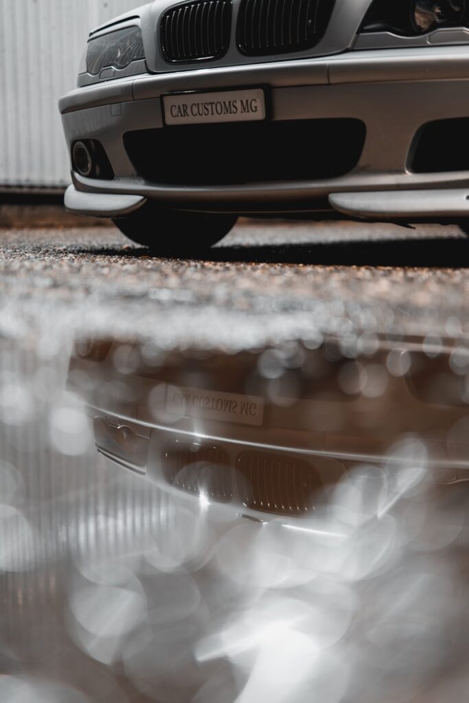 a silver car parked in front of a building