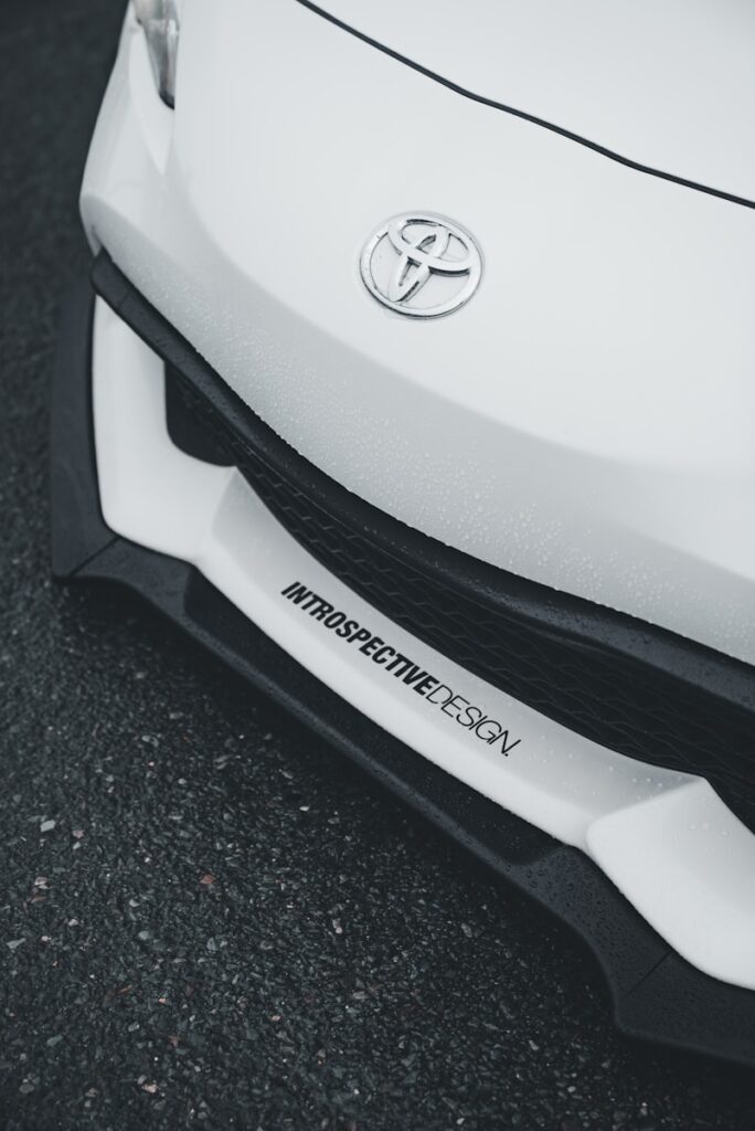 A white toyota car bumper close-up.