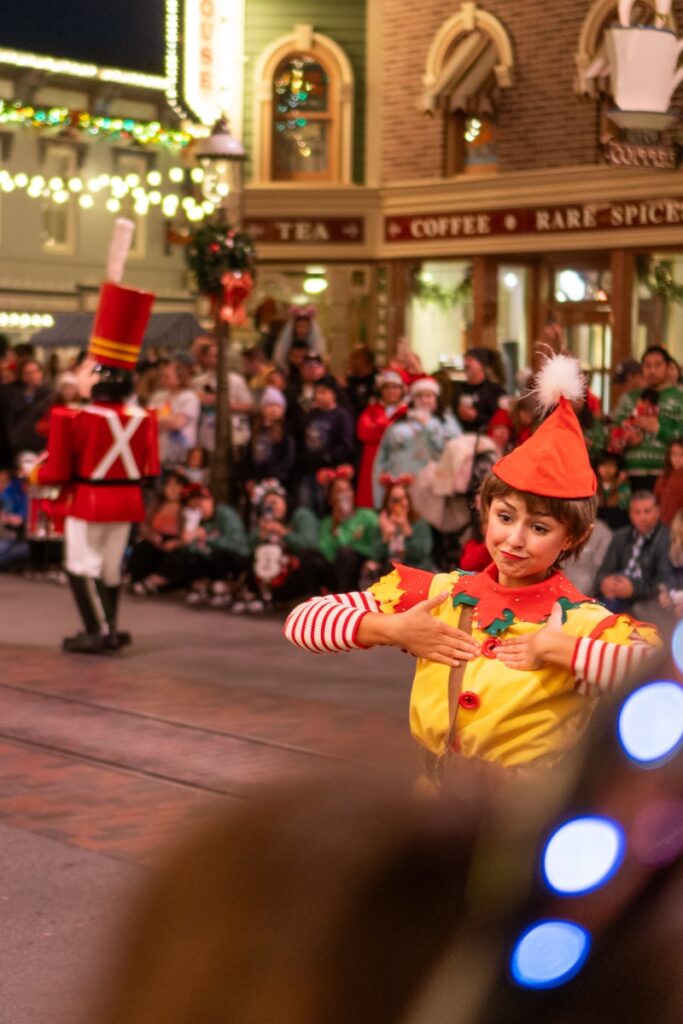 a small child dressed as a clown in a parade