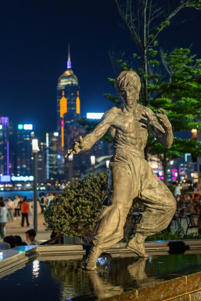 a statue of a man is in the middle of a fountain