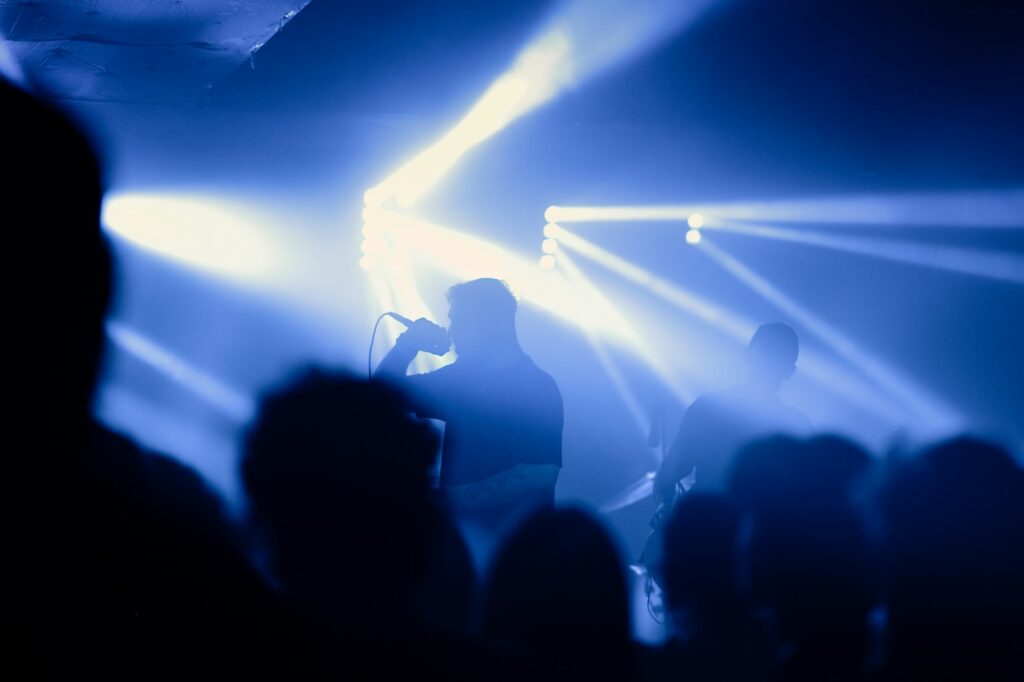 A group of people standing on top of a stage