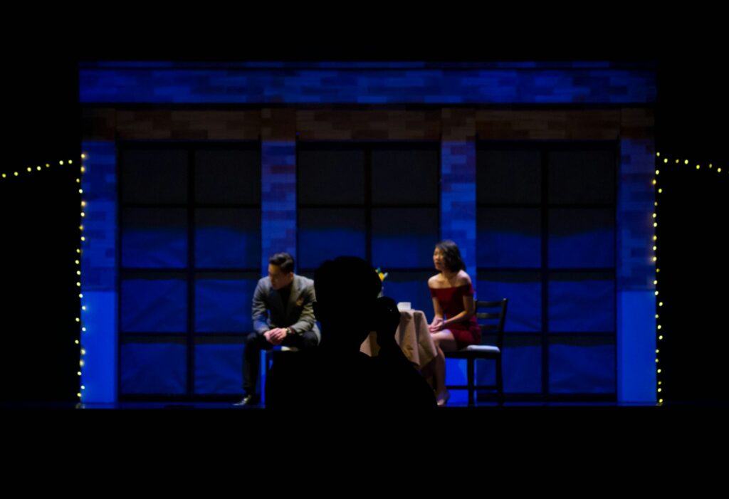 man and woman sitting on chair