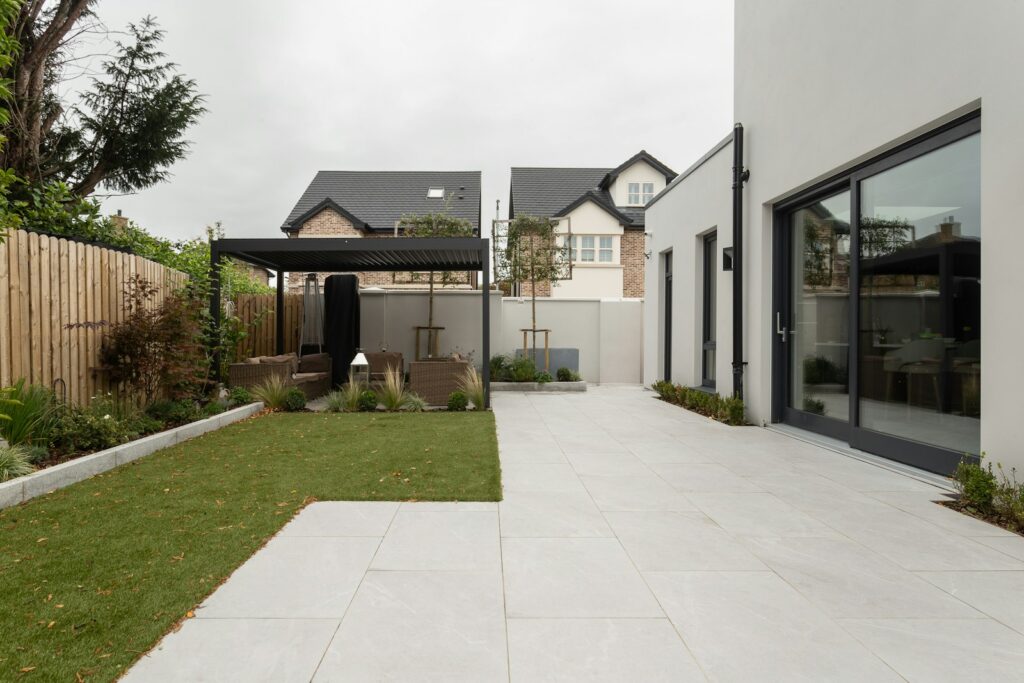 a house with a large yard and a covered patio