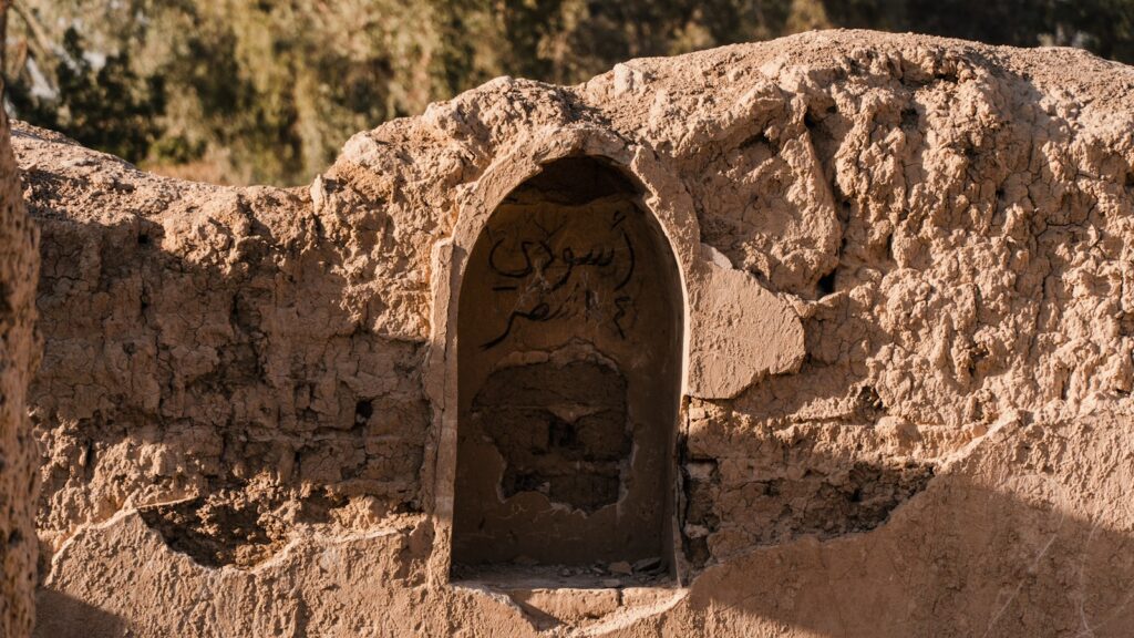 a rock with a small cave in the middle of it