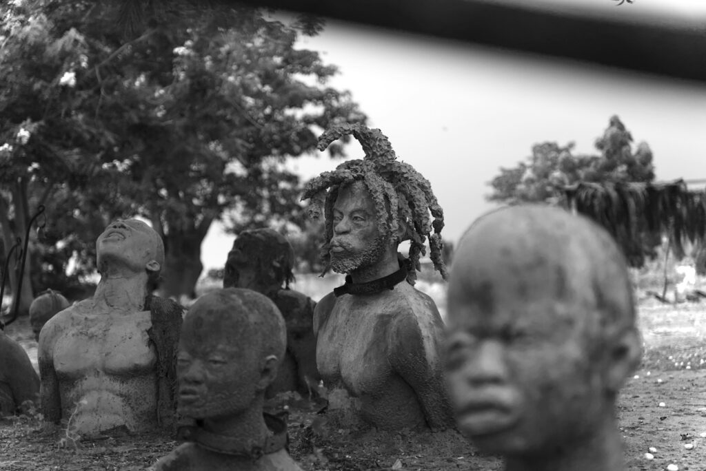 Sculptures of people in an outdoor setting