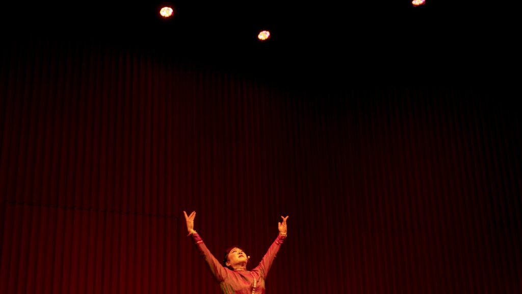 a man and woman on stage
