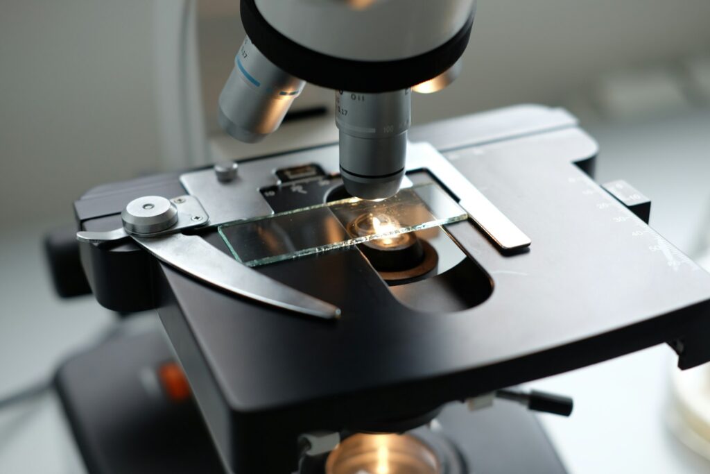 A microscope being used to examine a substance