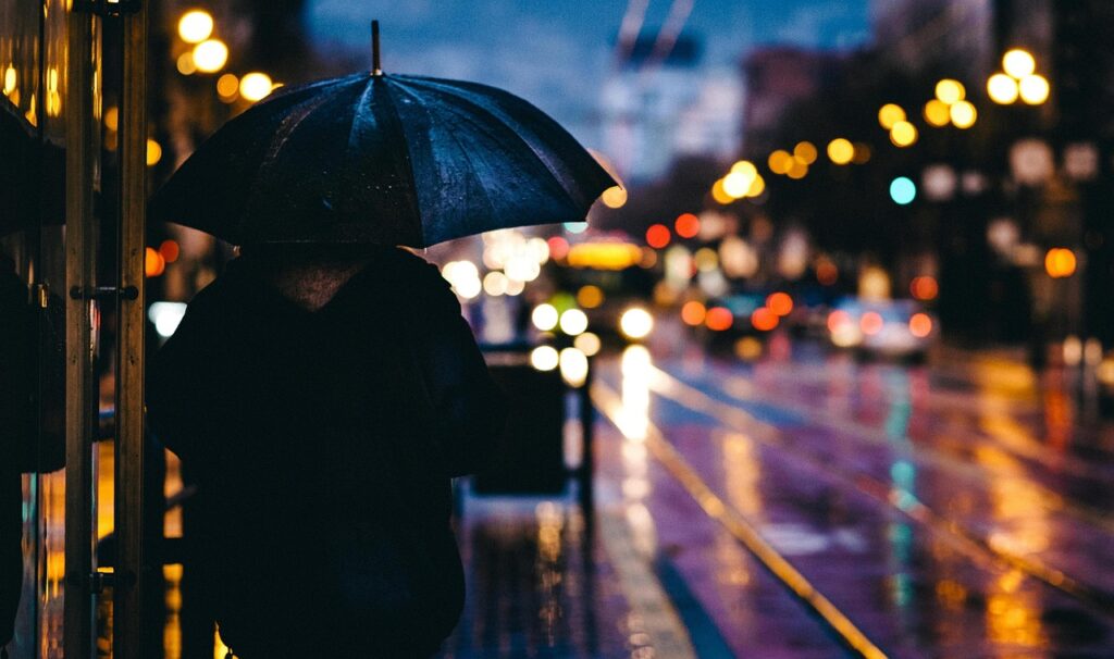 adult, blur, bokeh, city, evening, nature, light, man, outdoors, person, rain, reflection, road, street, umbrella, wet, raining