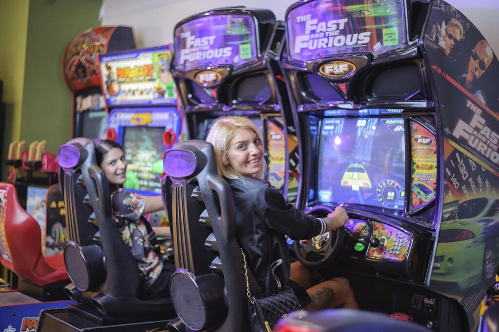 girls playing, car, game, girls, game automat, drive, simulator, playing, fast and the furious, arcade, car wallpapers, driving, arcade games, activity, machine, fun, happy, joy, play, race, smile, colorful, joyful