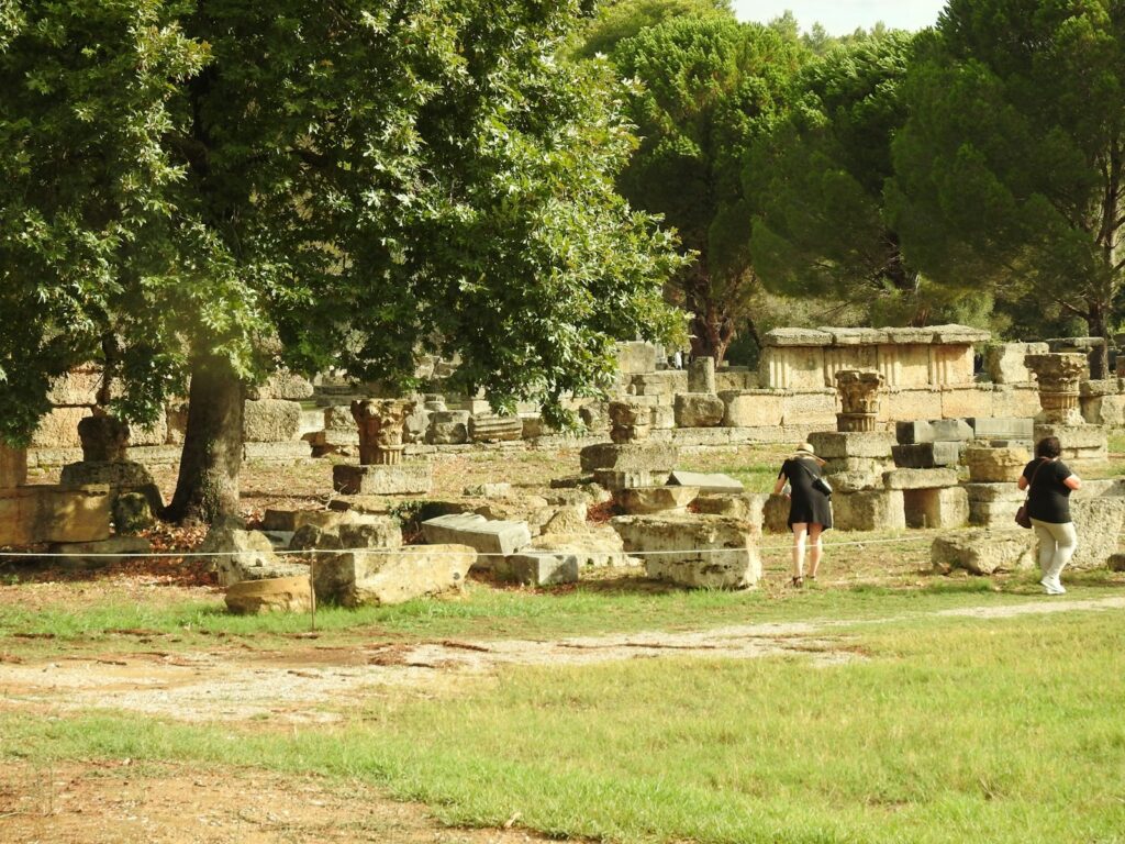 a group of people standing around a stone structure