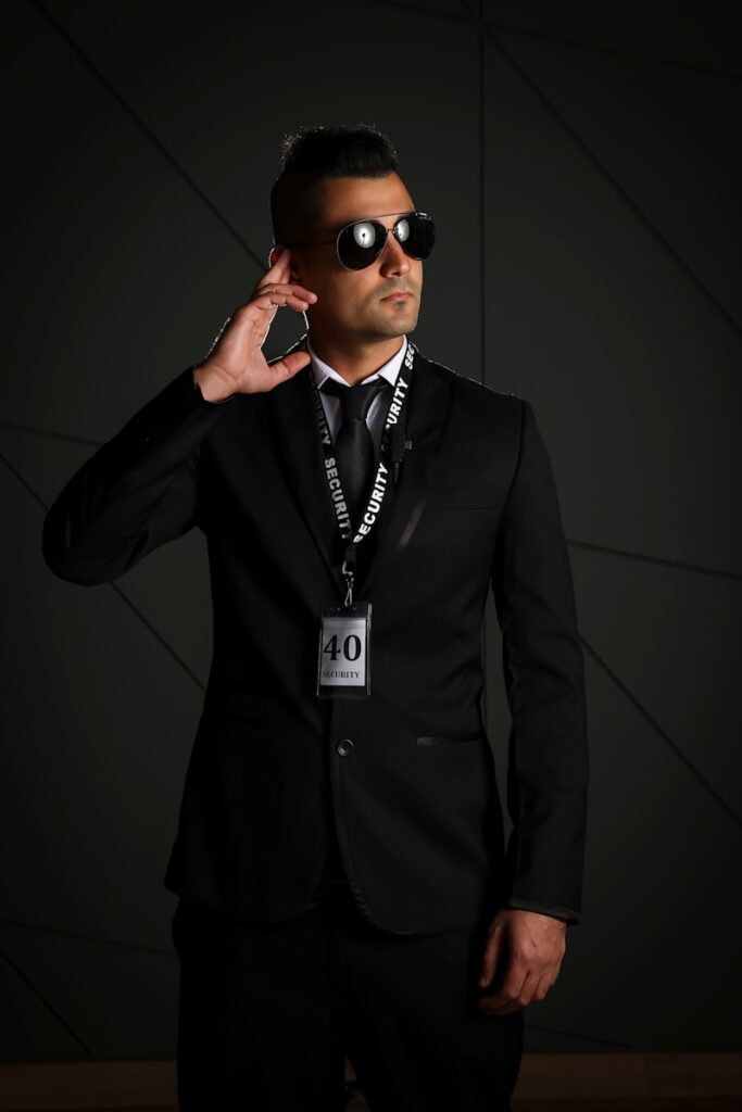 man in black suit wearing black sunglasses
