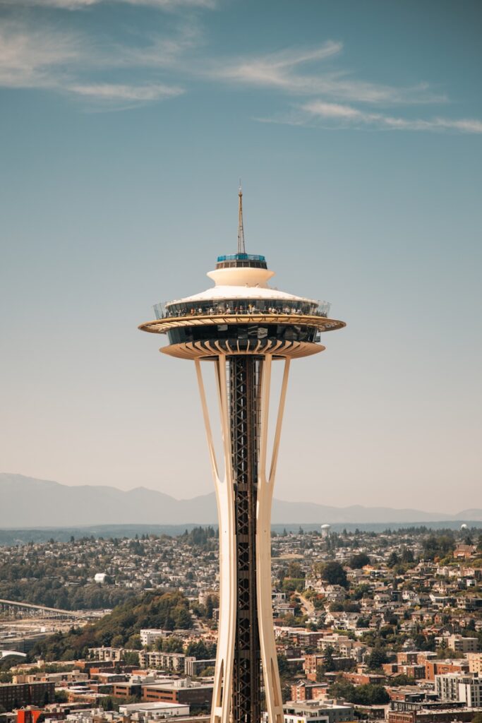 A tall tower with a sky scraper on top of it