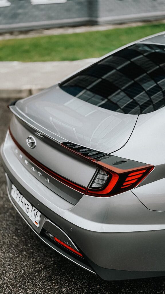 Close-up of a sleek silver sedan showcasing its modern taillight design.