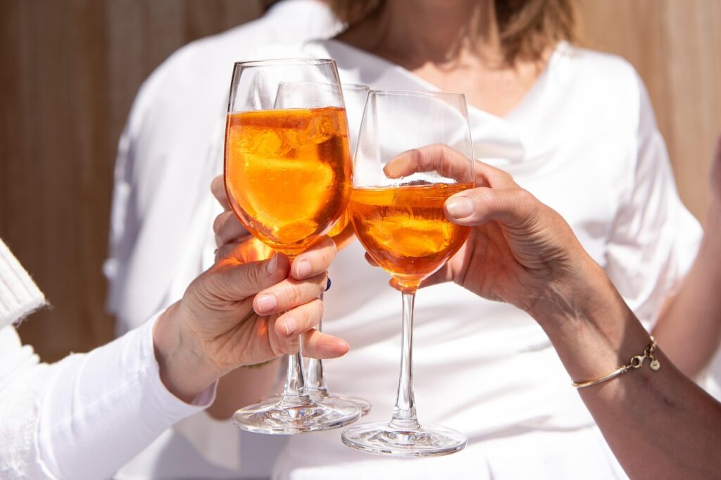 glasses, drink, alcohol, cocktail, party, beverage, liquor, refreshment, alcoholic, celebration, orange, aperol, aperol spritz, toast, cheers, celebrate, hands, friendship, alcohol, alcohol, alcohol, alcohol, alcohol, party, party, party, party, liquor, toast, cheers, cheers, cheers, cheers