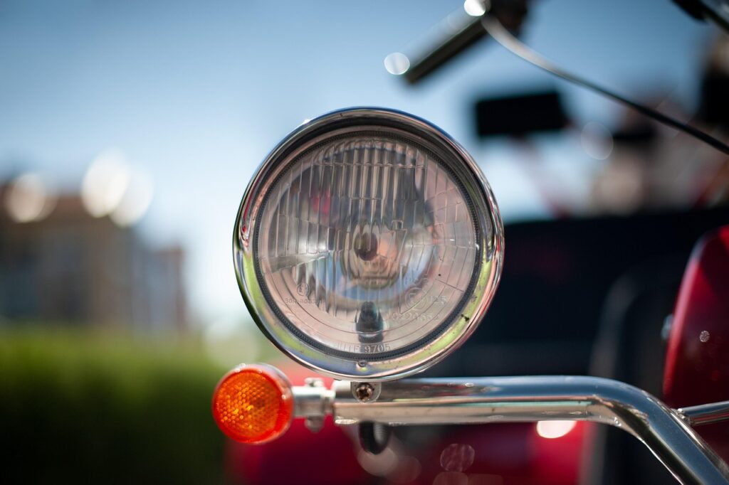 motorcycle, light, turn signal, blinker, closeup, macro, blurred, street, transport