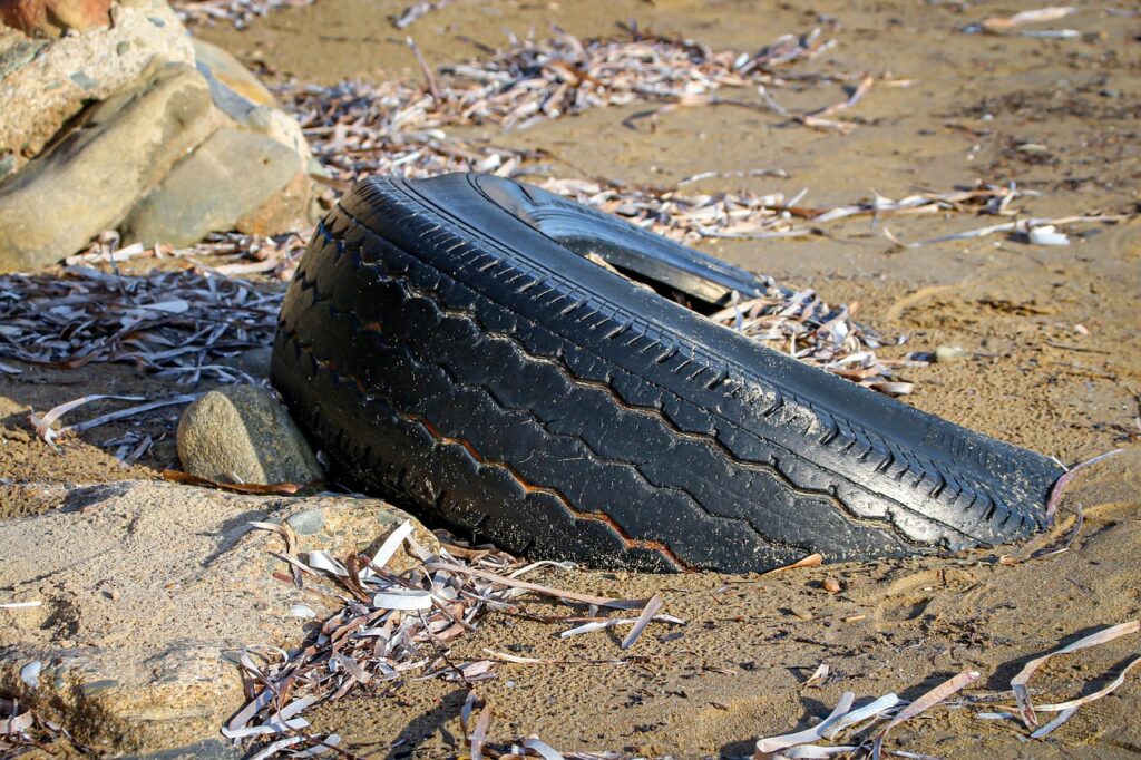 environmental pollution, nature, tire, car tire, rubber, waste, environment, old tires, garbage, disposal, tire profile, thrown away, black, beach, sand, ugly