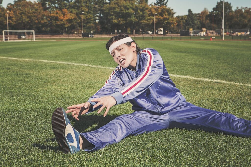 stretching, sports, woman, athlete, nature, fitness, sport, healthy, exercise, workout, young, female, body, lifestyle, training, fit, health, stretch, people, active, girl, adult, person, sportswear, athletic, gym, exercising, physical, sporty, white, pilates, leisure, tracksuit, track and field, shoes, headband, grass, field