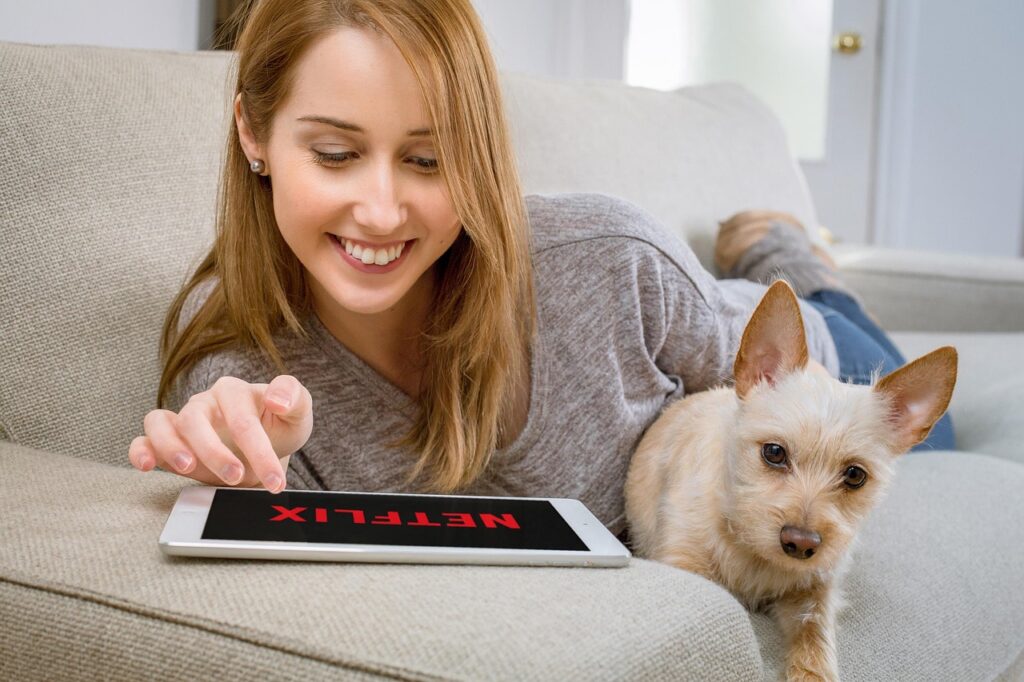 woman, dog, netflix, tablet, animal, streaming, video, movies, home, pet, couch, leisure