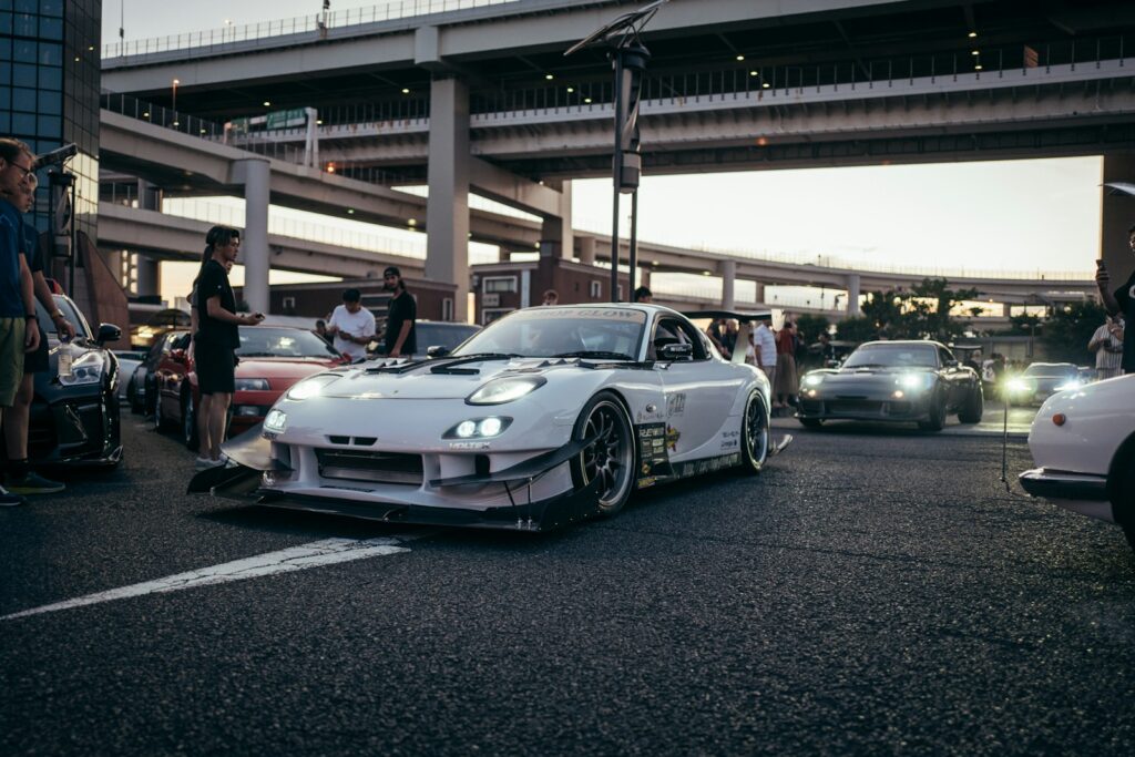 White sports car with custom body kit on street