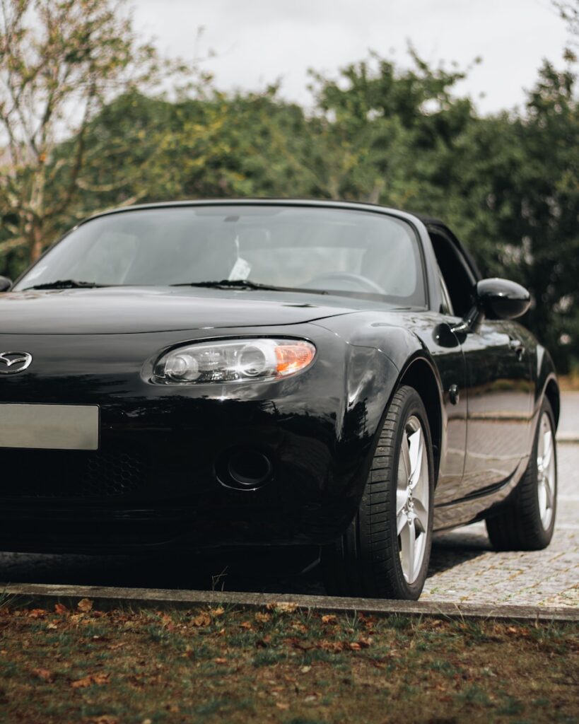 a black car parked on a road