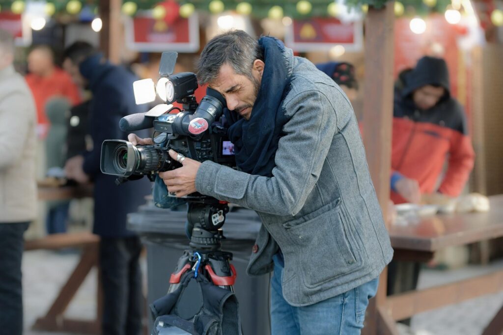 man, recording, camera, people, staff, movie, event, evening, entertainment, lights, cameraman, job, tv, equipment, winter, tripod, snapshot, street photography