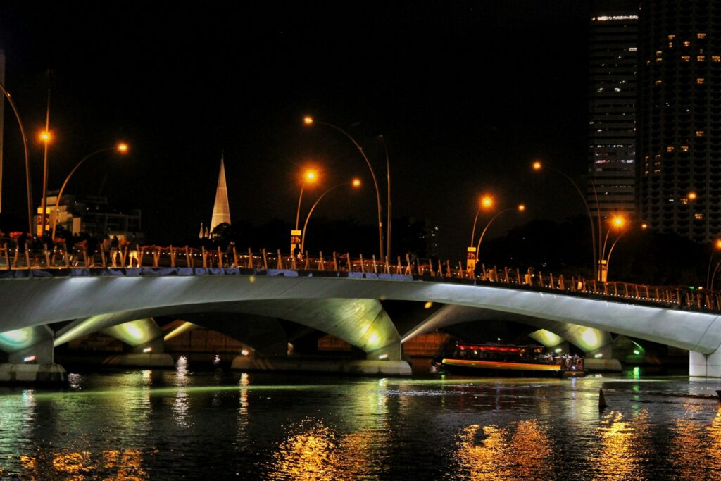 a bridge over a body of water at night