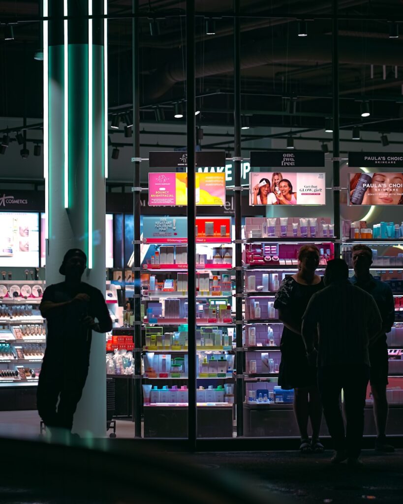A group of people standing in front of a store