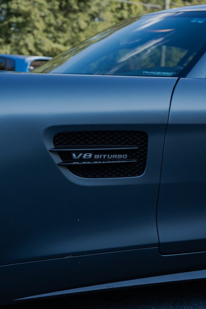 Close-up of v8 biturbo emblem on car door