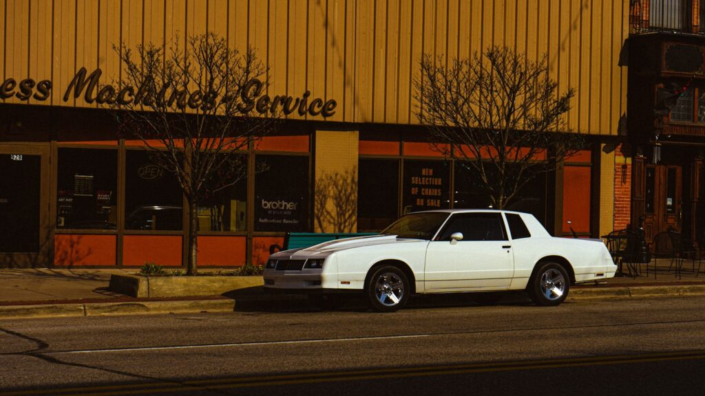 a white car parked on the side of the road