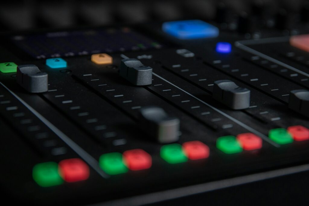 A close-up view of a sound mixing console.