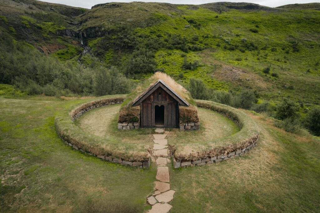 an aerial view of a house with a grass roof