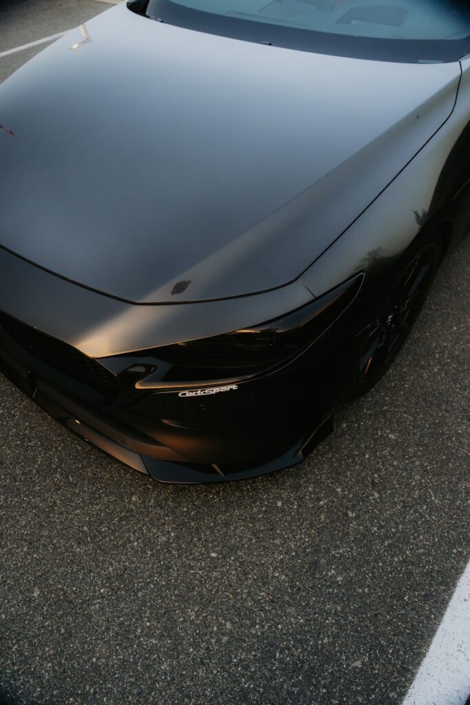 A black sports car parked in a parking lot