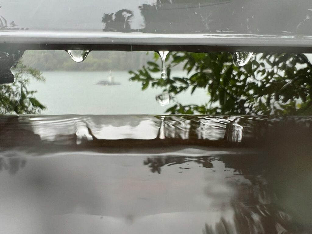 a reflection of a boat in the water