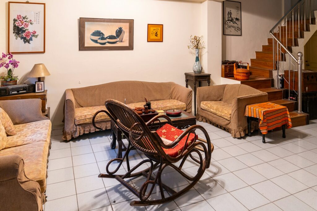 Cozy living room with vintage furniture and staircase