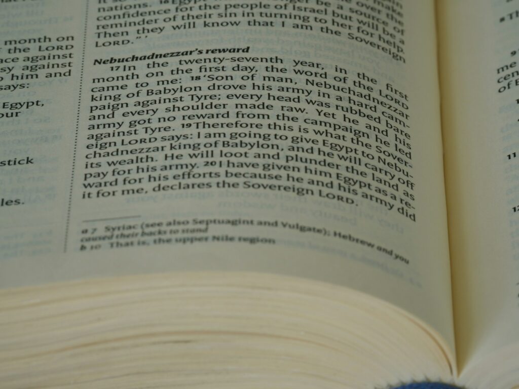 a close up of an open book on a table