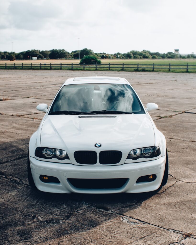 white bmw car on road during daytime