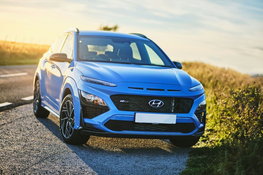 a blue car on a road