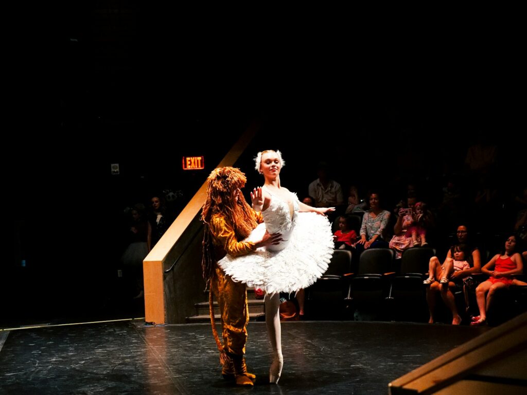 A couple of people that are standing on a stage