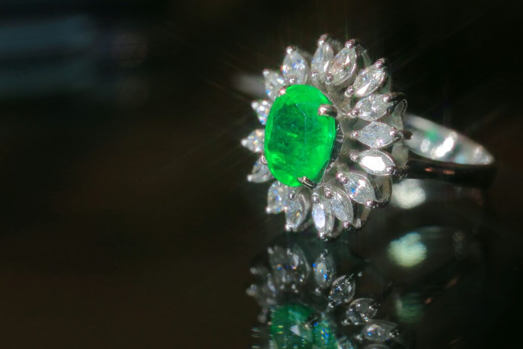 A close up of a ring with a green stone
