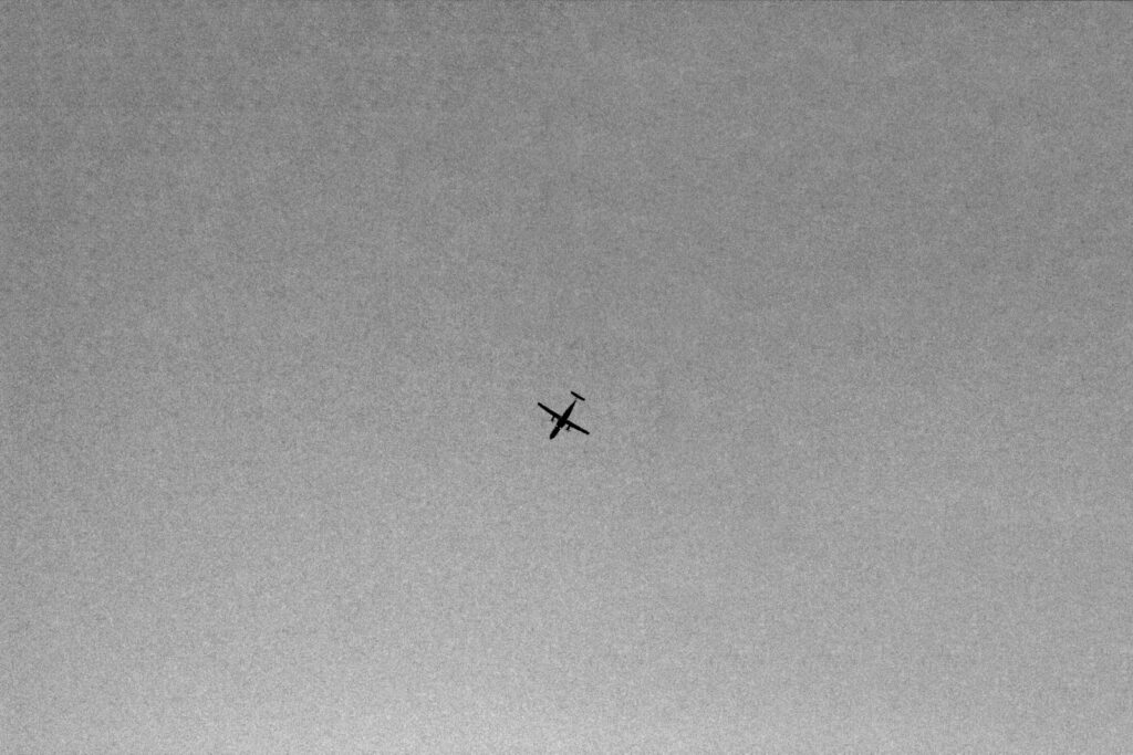 an airplane is flying high in the sky