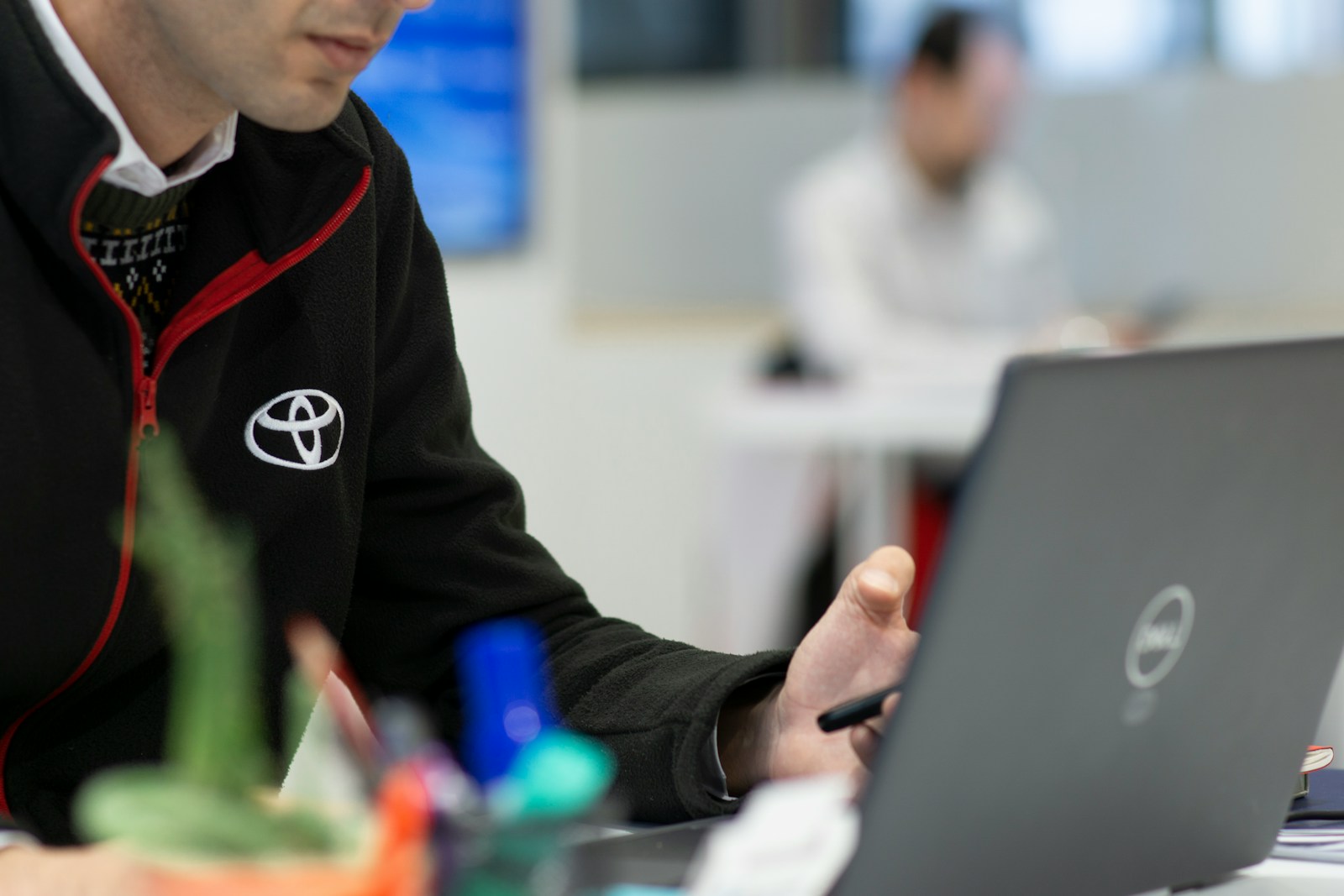 A man sitting in front of a laptop computer